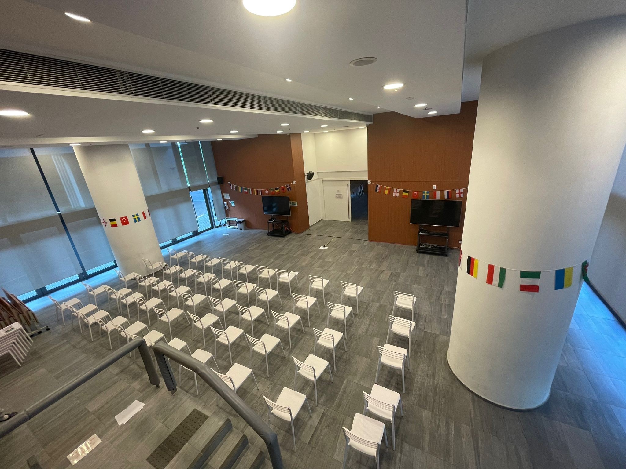 https://d26ql2nsjs5ylm.cloudfront.net/files/684c824ea6a8fb0002a99f31/8lqdmht2u-M2with30chairsandstagesetting_3.jpeg